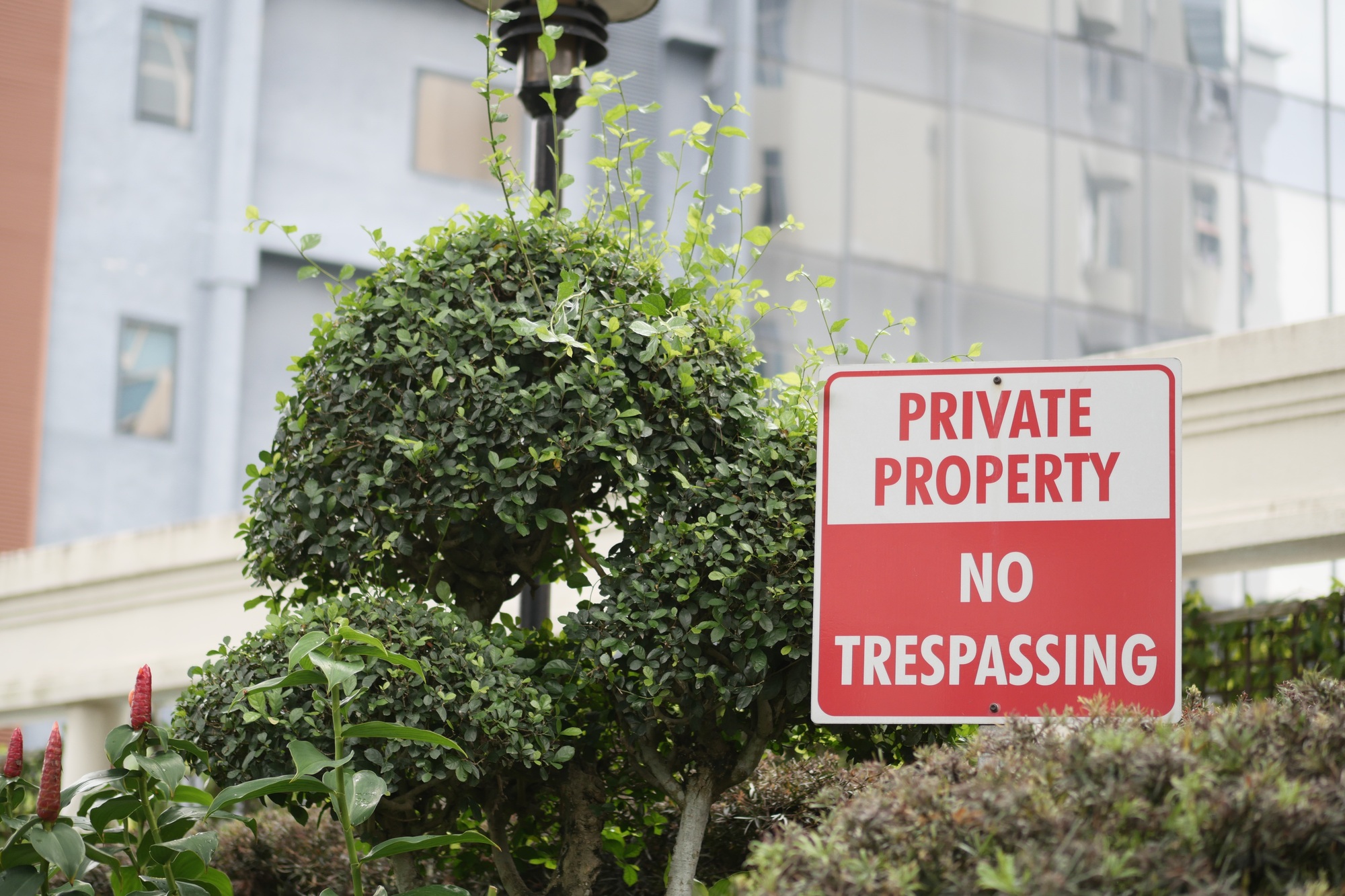 Private Property No trespassing text and buildings